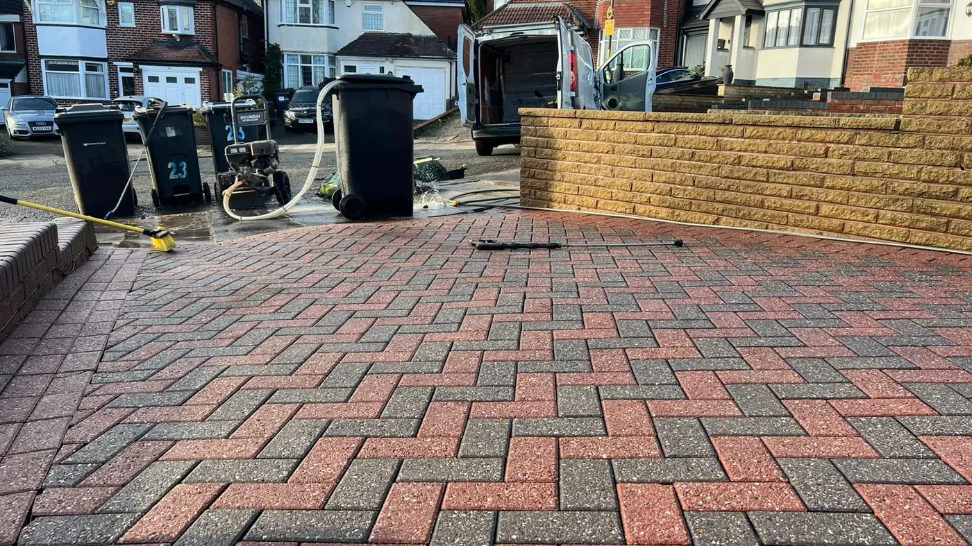 Jet washing equipment set up on a driveway mid-job in Bromsgrove