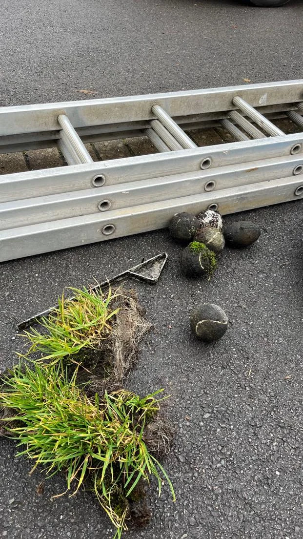 Moss and debris removed from gutters during professional cleaning in Bromsgrove