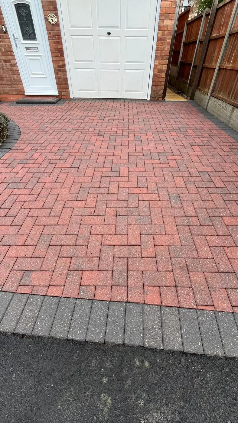 Clean block paved driveway after jet washing