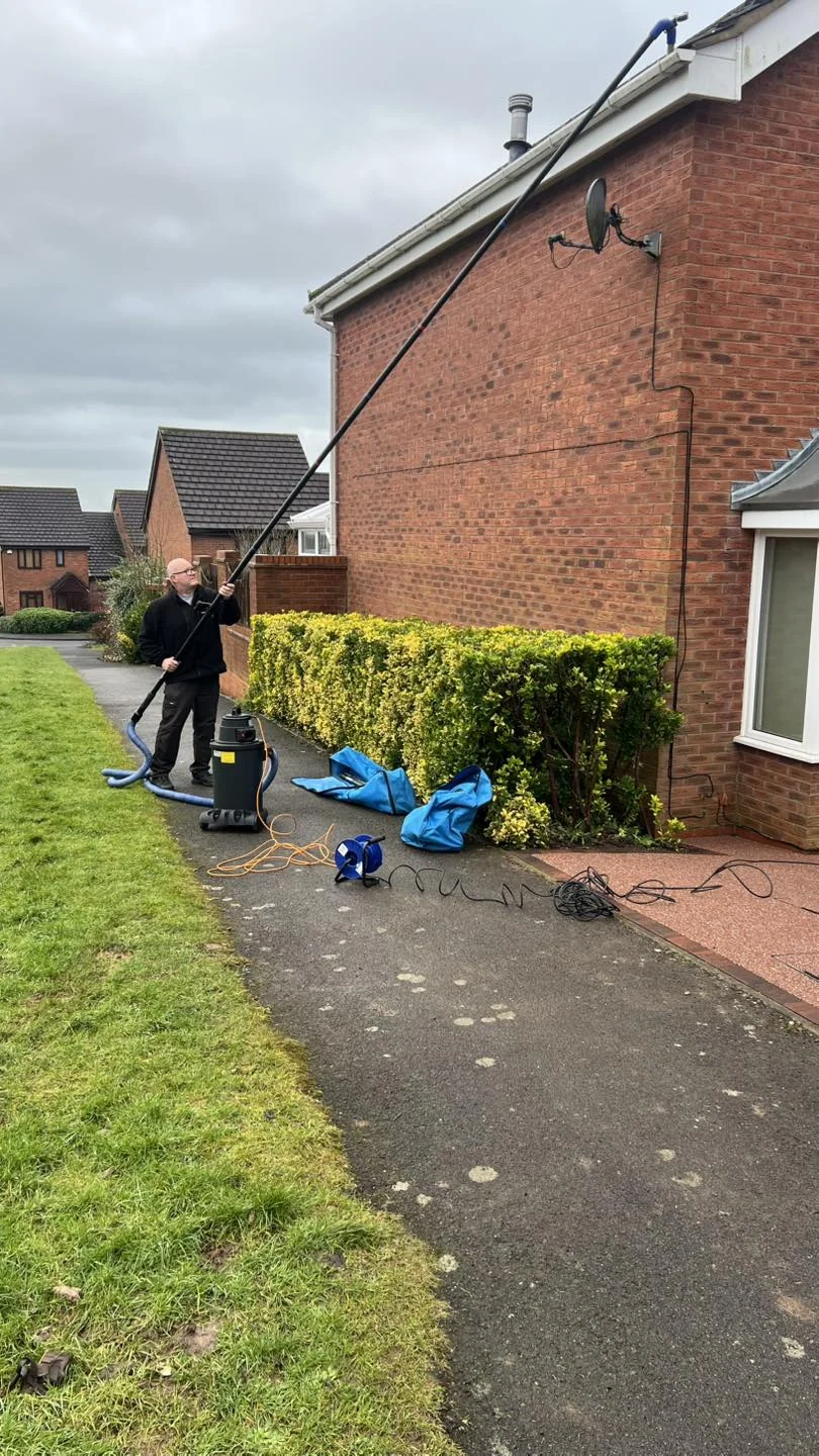 SkyVac gutter cleaning system being used from the ground on a Bromsgrove property